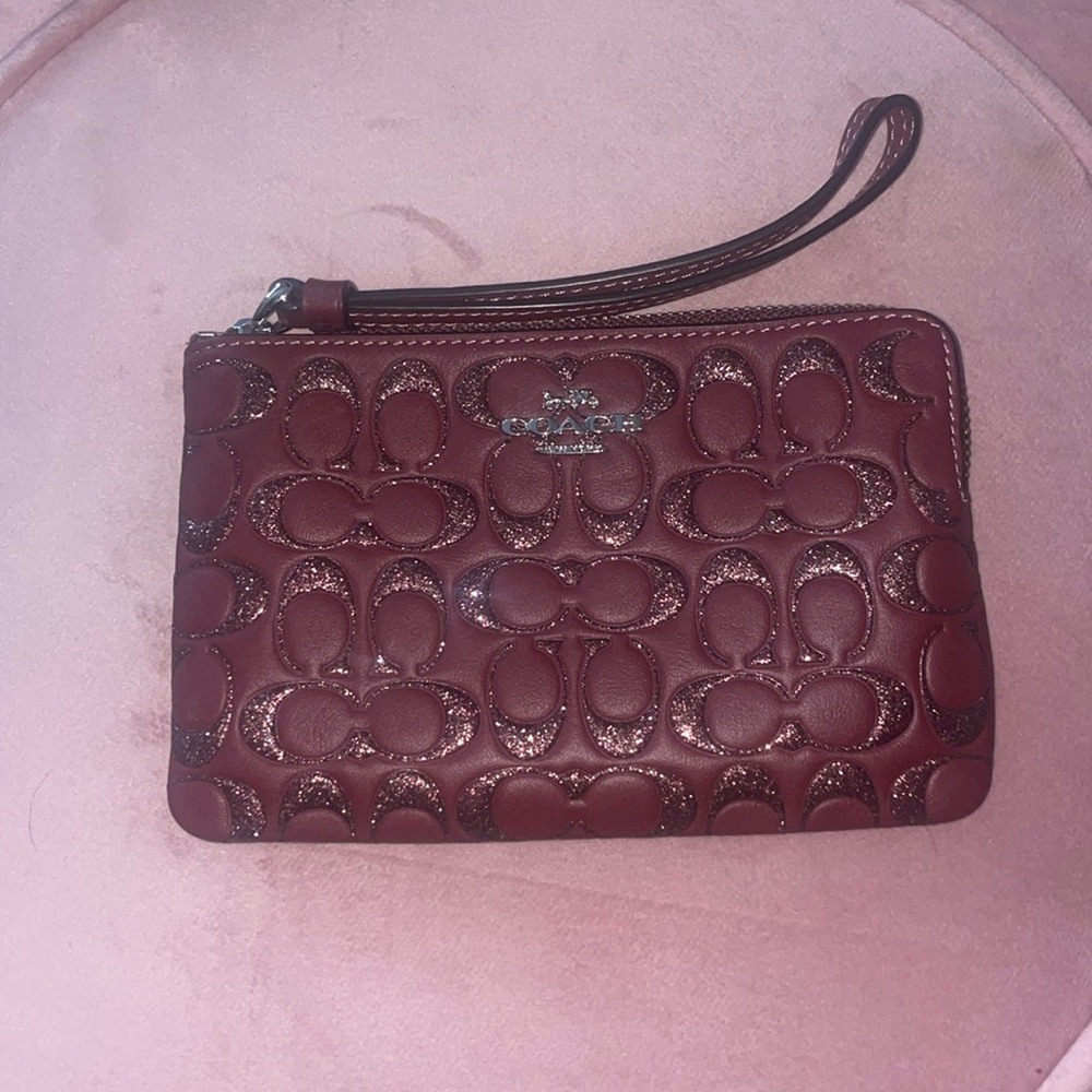 Burgundy Coach wristlet with glitter